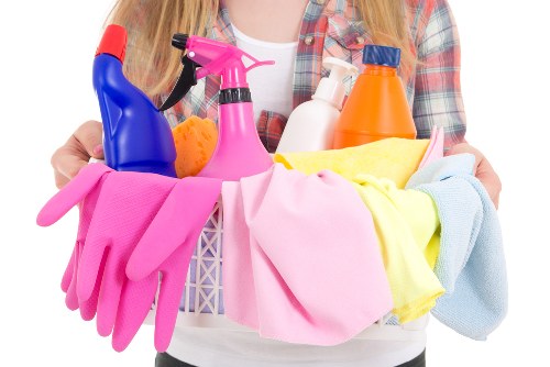 Cleaner using protective equipment while handling cleaning chemicals
